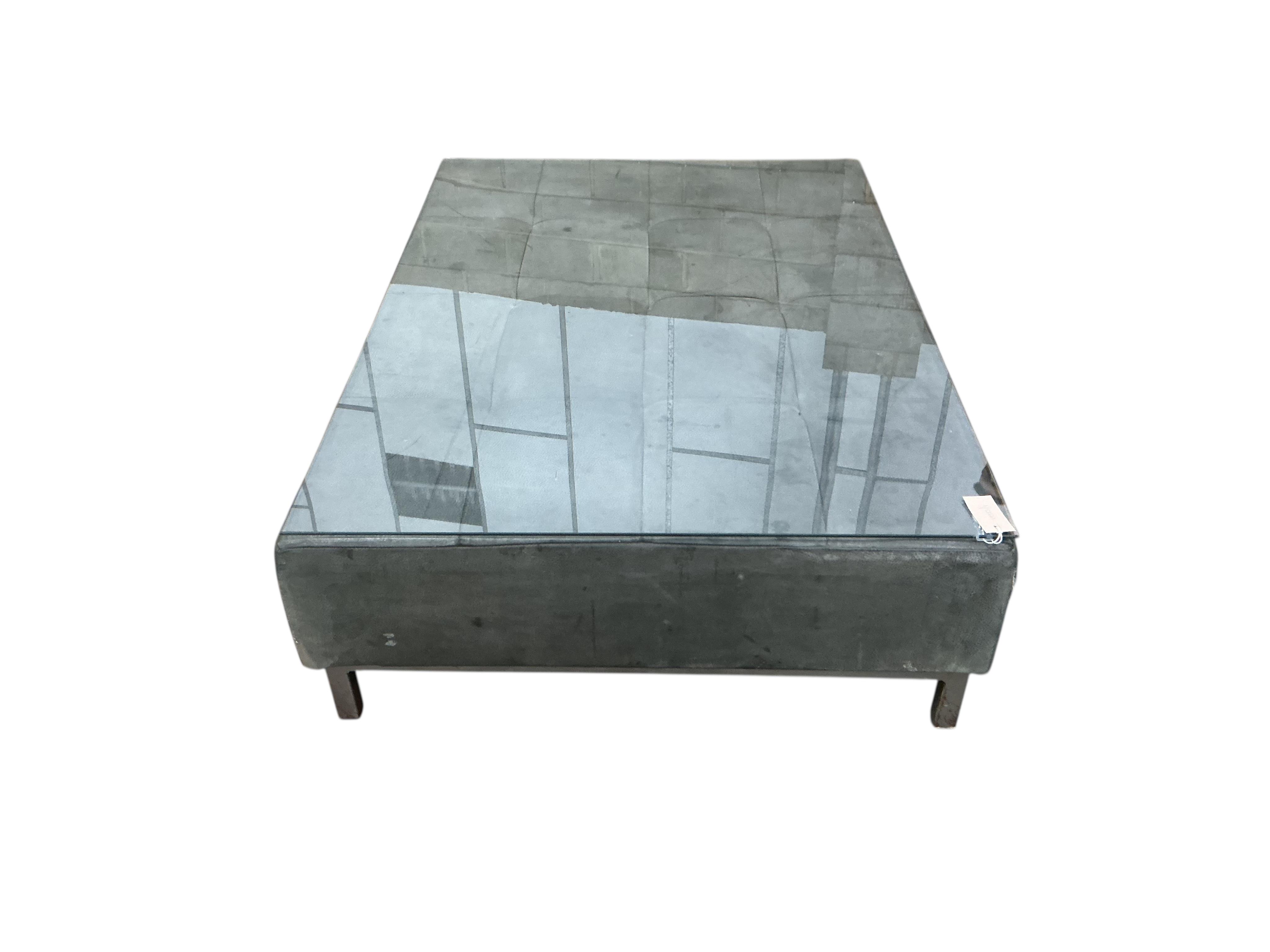 A contemporary leather rectangular ottoman stool with plate glass top, width 124cm, depth 88cm, height 34cm